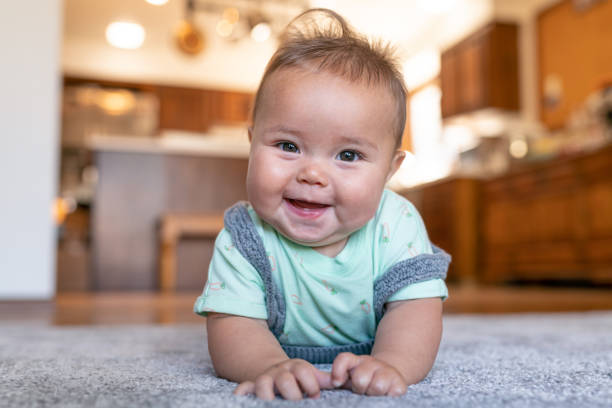 Baby laying on carpet floorings | Flooring by Wilson's Carpet Plus